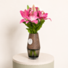 Premium pink Stargazer lilies arranged in a decorative vase by Marino Flowers.