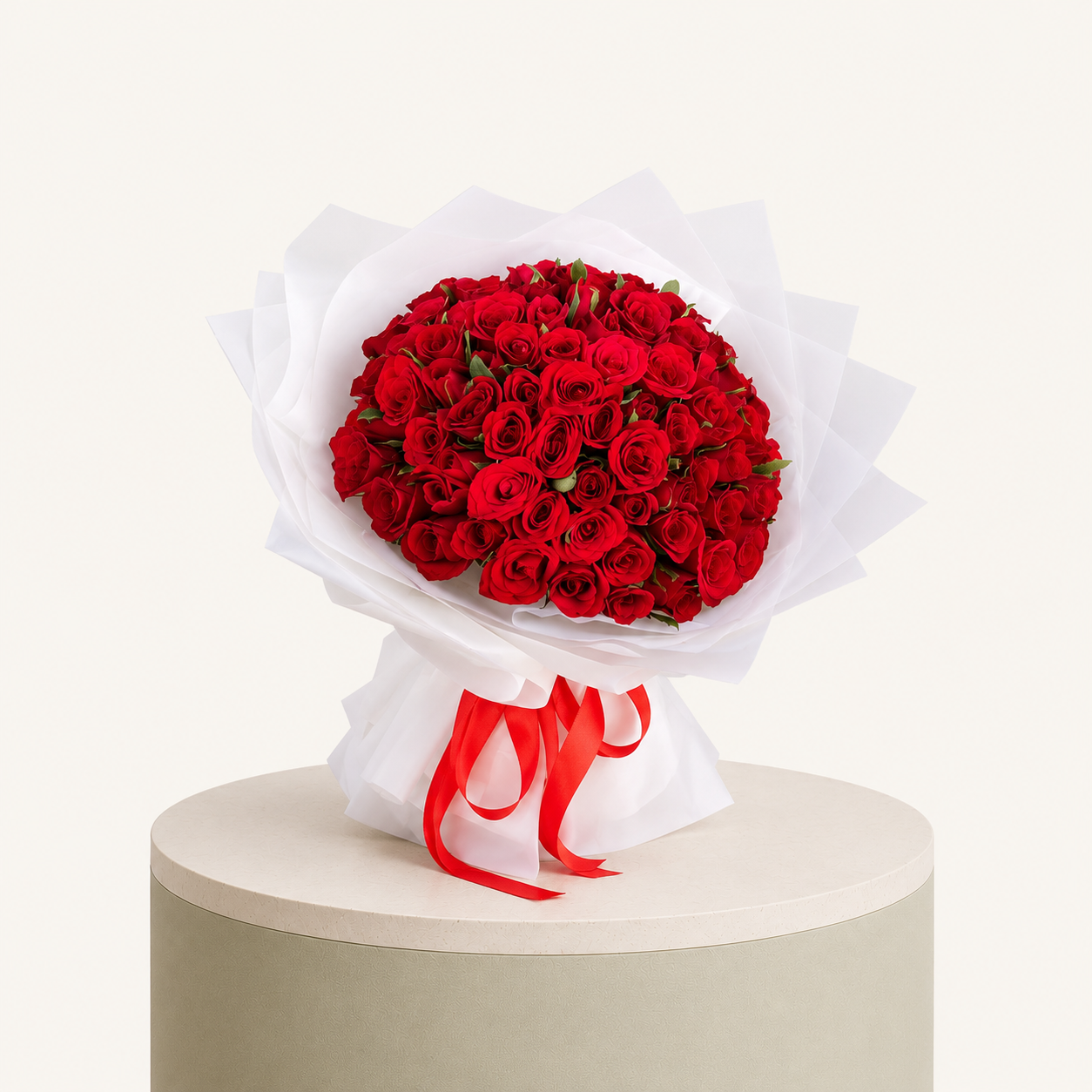 60 fresh red roses wrapped in elegant white paper with a red ribbon by Marino Flowers.