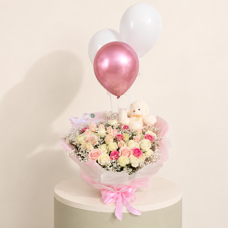 40 fresh roses bouquet in pink and white shades with baby’s breath, teddy bear, and balloons by Marino Flowers.