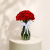 40 premium red roses arranged in a luxury glass vase with a white ribbon by Marino Flowers.