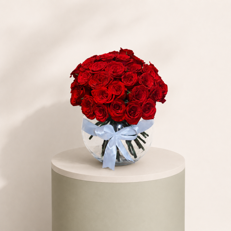 50 red roses arrangement in a glass vase with decorative ribbon by Marino Flowers