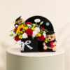 Graduation black stand with red roses, sunflowers, lisianthus, and teddy bear by Marino Flowers