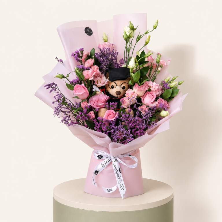 Medium graduation bouquet with pink and white flowers and graduation teddy by Marino Flowers