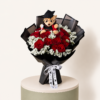 20 red roses with graduation teddy in black wrapping by Marino Flowers