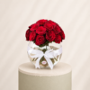 20 premium red roses arranged in an elegant glass bowl vase with a decorative white ribbon by Marino Flowers.